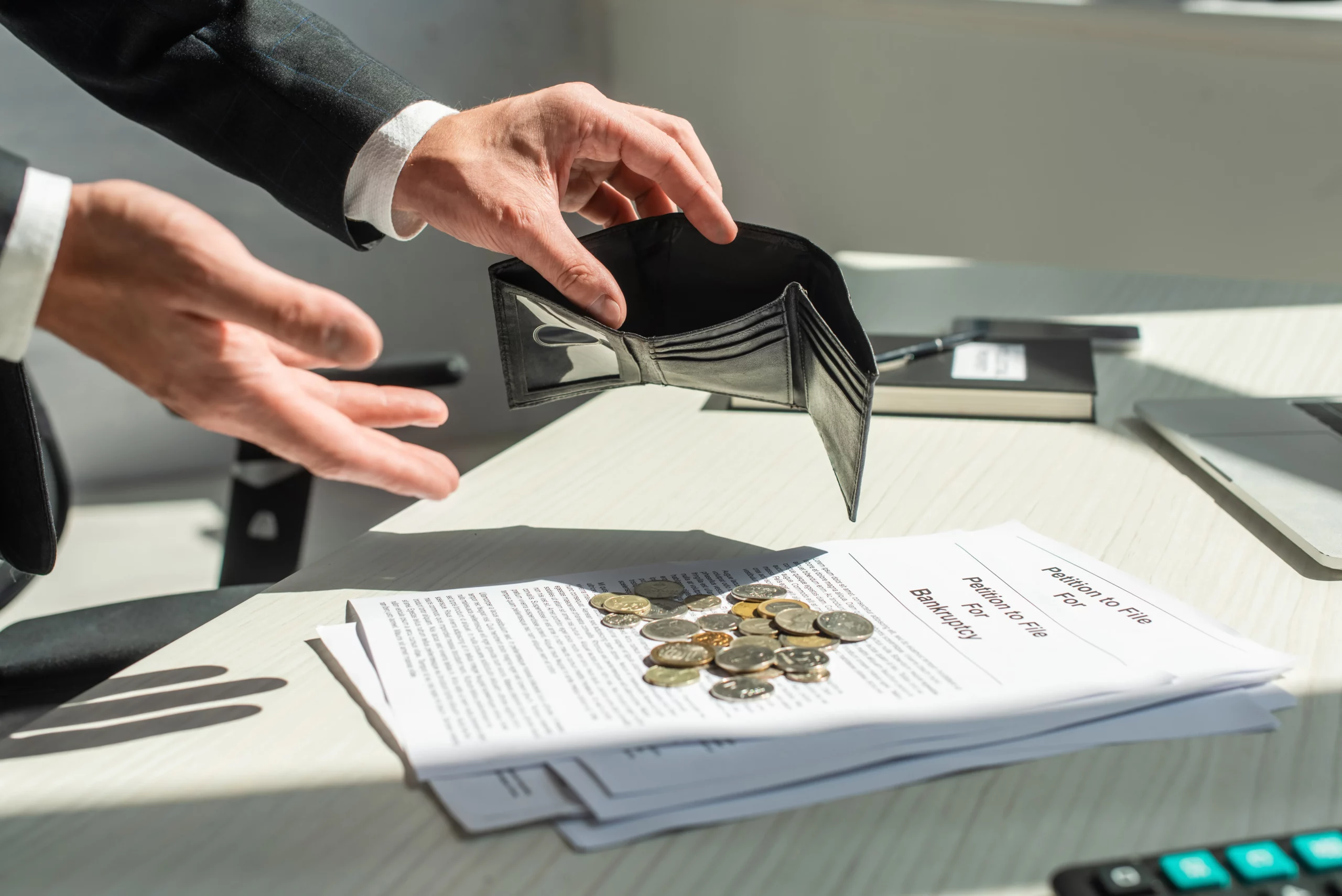 Person holding an empty wallet due to wage garnishment before filing for bankruptcy